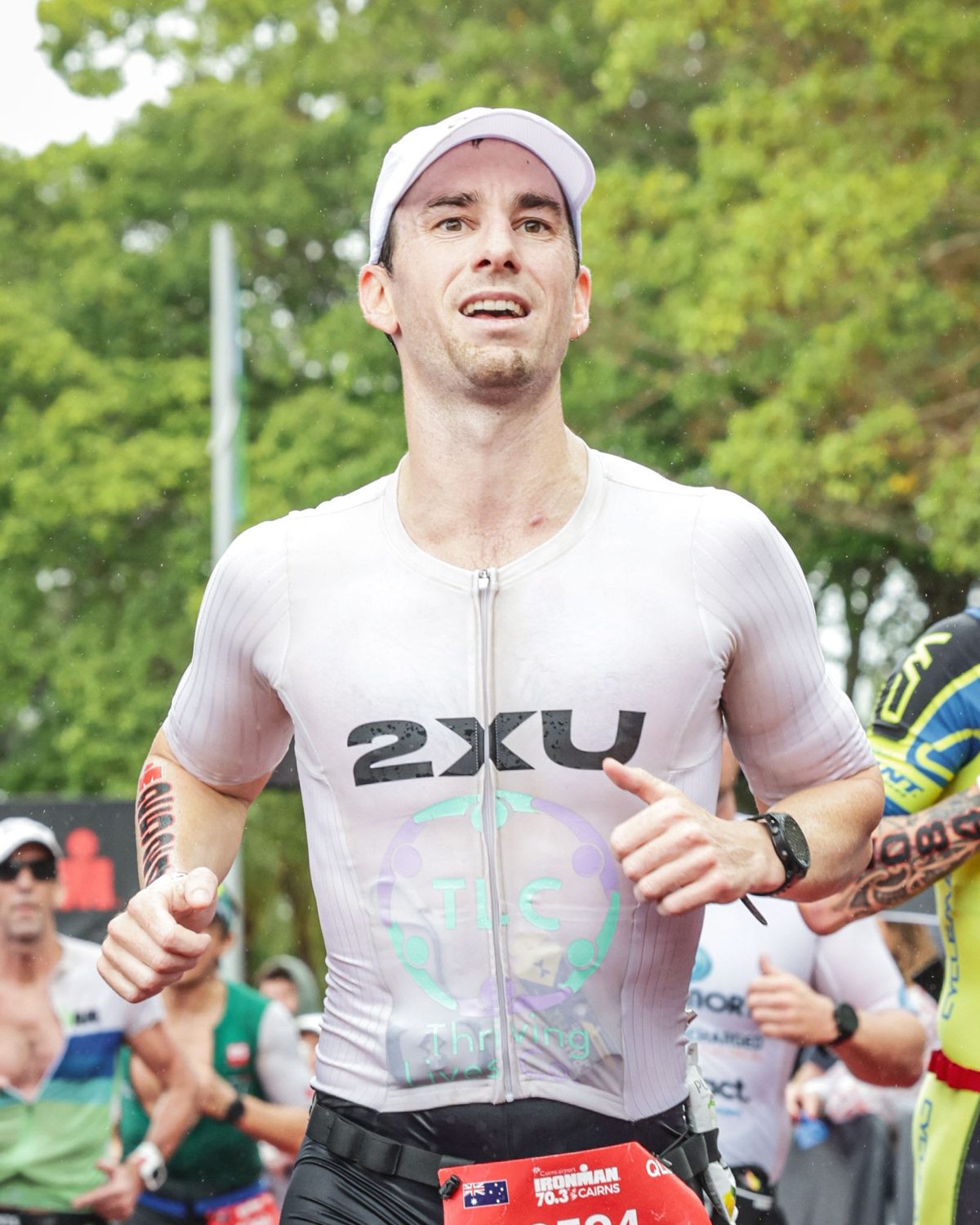 Kadell running down the finish chute at Ironman 70.3 Cairns